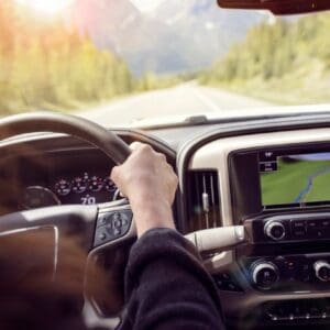 Driver's view: dashboard GPS on mountain road